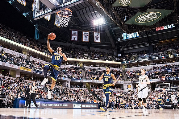 Derrick Walton Jr. (10) and Zak Irvin (21)