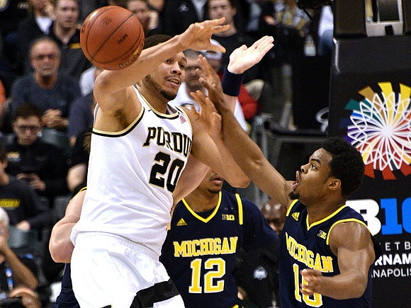 Muhammad-Ali Abdur-Rahkman (12) and Derrick Walton Jr. (10)