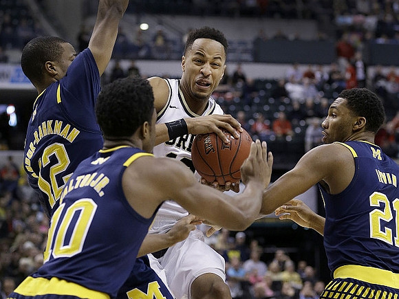 Muhammad-Ali Abdur-Rahkman (12), Derrick Walton Jr. (10), and Zak Irvin (21)