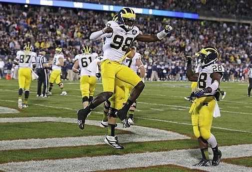Devin Gardner (98), Fitzgerald Toussaint (28), Graham Glasgow (61), and Devin Funchess (87)