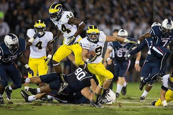 Cameron Gordon (4), Delano Hill (44), and Drew Dileo (9)