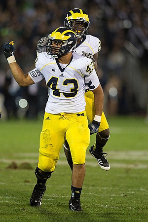 Chris Wormley (43) and Jarrod Wilson (22)