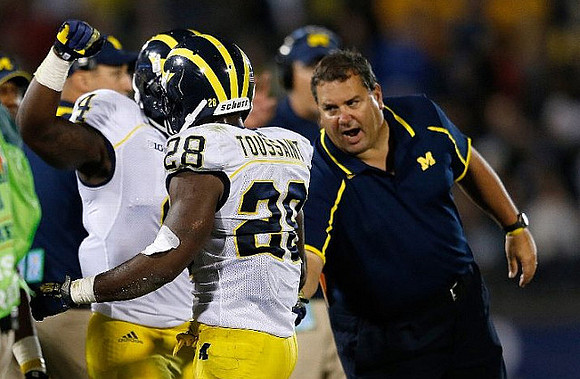Cameron Gordon (4), Devin Gardner (98), and Brady Hoke