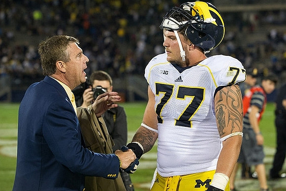 David Brandon and Taylor Lewan (77)