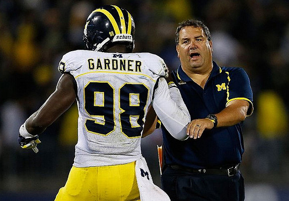 Devin Gardner (98) and Brady Hoke