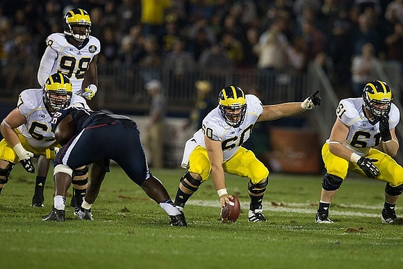 Kyle Kalis (67), Devin Gardner (98), Jack Miller (60), and Graham Glasgow (61)