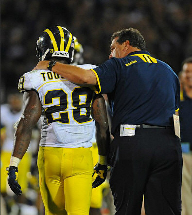 Fitzgerald Toussaint (28) and Brady Hoke