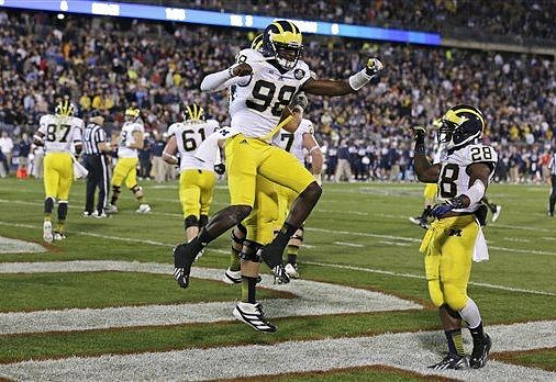 Devin Gardner (98), Fitzgerald Toussaint (28), Graham Glasgow (61), and Devin Funchess (87)