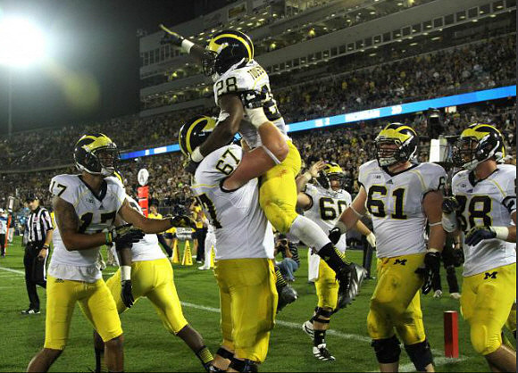 Jeremy Jackson (17), Kyle Kalis (67), Fitzgerald Toussaint (28), Jack Miller (60), Graham Glasgow (61), and Jake Butt (88)