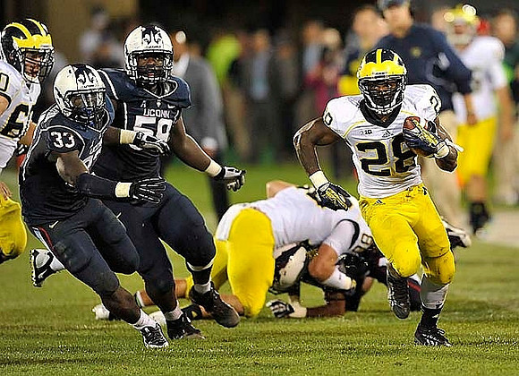 Jack Miller (60), Fitzgerald Toussaint (28), and Jake Butt (88)