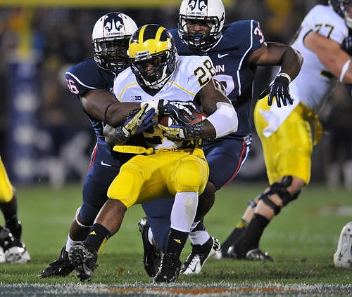 Fitzgerald Toussaint (28) and Taylor Lewan (77)