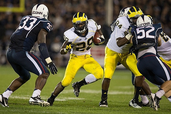 Fitzgerald Toussaint (28) and A.J. Williams (84)