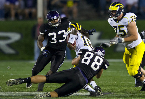 Denard Robinson (16) and Michael Schofield (75)