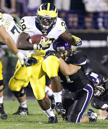 Fitzgerald Toussaint (28) and Michael Schofield (75)