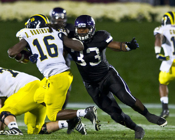 Denard Robinson (16) and Kelvin Grady (19)