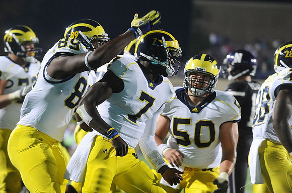 Mark Huyge (72), Brandon Moore (89), Devin Gardner (7), David Molk (50), and Fitzgerald Toussaint (28)