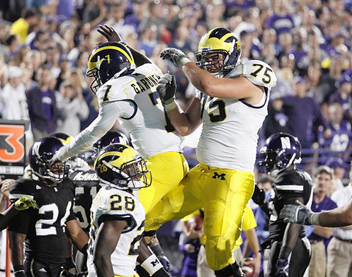 Fitzgerald Toussaint (28), Devin Gardner (7), and Michael Schofield (75)