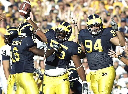 Brandon Graham, Donovan Warren, and John Ferrara