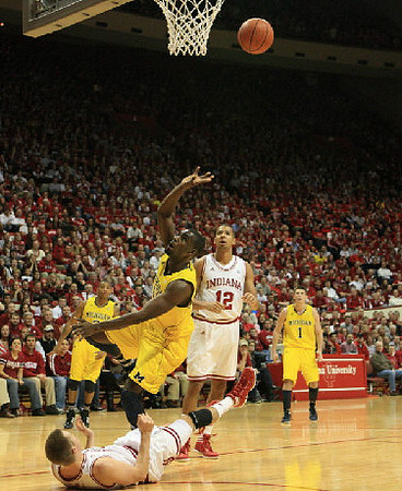 Trey Burke (3), Tim Hardaway Jr. (10), and Stu Douglass (1)