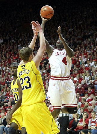 Tim Hardaway Jr. (10) and Evan Smotrycz (23)