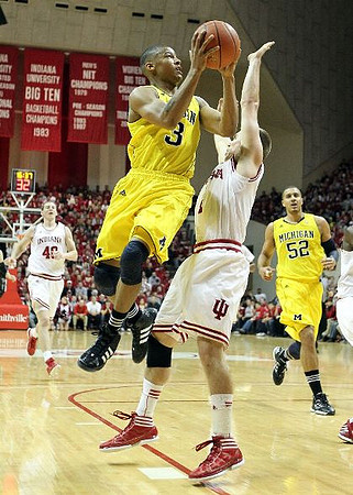 Trey Burke (3) and Jordan Morgan (52)