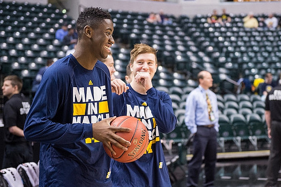 Caris LeVert (23) and Spike Albrecht (2)