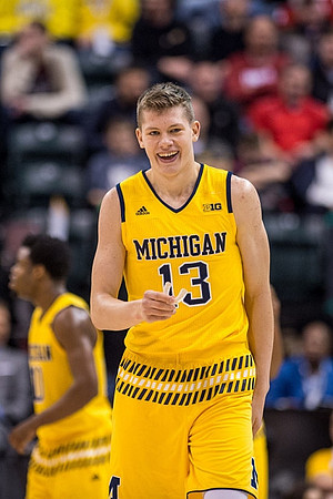 Derrick Walton Jr. (10) and Moritz Wagner (13)