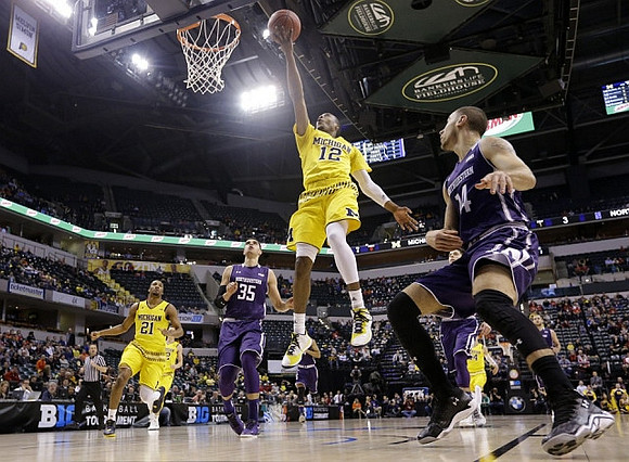 Zak Irvin (21), Muhammad-Ali Abdur-Rahkman (12), and Aubrey Dawkins (24)