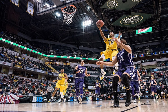 Zak Irvin (21) and Muhammad-Ali Abdur-Rahkman (12)