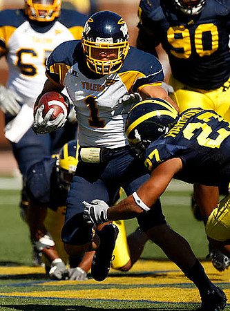 Brandon Harrison (27) and Tim Jamison (90)