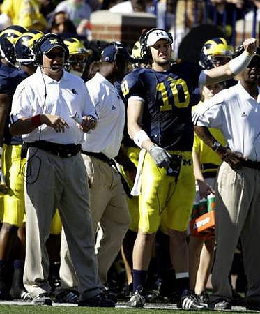 Rich Rodriguez  and Steven Threet (10)