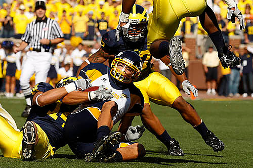 Morgan Trent (14) and Brandon Harrison (27)