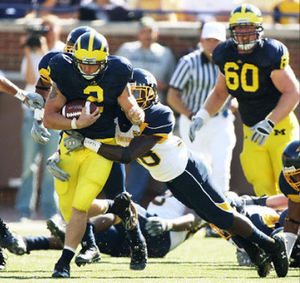 Sam McGuffie (2) and David Moosman (60)