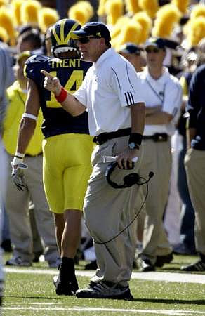 Morgan Trent (14) and Rich Rodriguez