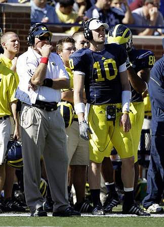 Rich Rodriguez, Steven Threet (10), and Kevin Koger (86)