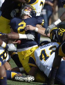 Sam McGuffie (2) and David Molk (50)