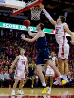 Jon Teske (15) and Jordan Poole (2)