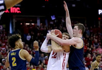 Jordan Poole (2) and Jon Teske (15)