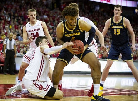 Isaiah Livers (4) and Jon Teske (15)