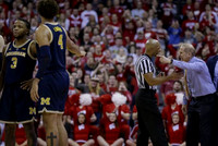 Zavier Simpson (3), Isaiah Livers (4), and John Beilein