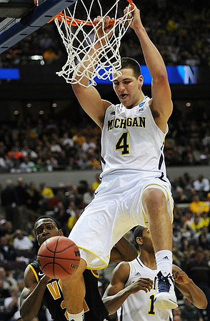 Mitch McGary (4) and Glenn Robinson III (1)