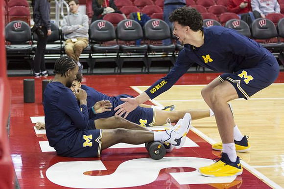 Zavier Simpson (3), Jordan Poole (2), and Brandon Johns Jr. (23)