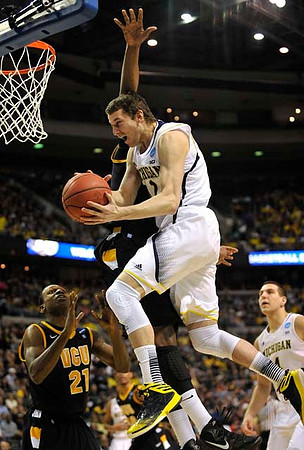 Nik Stauskas (11) and Mitch McGary (4)
