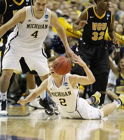 Mitch McGary (4) and Spike Albrecht (2)