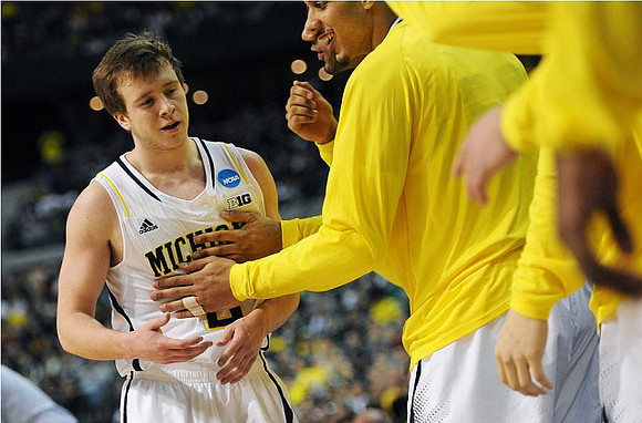 Spike Albrecht (2) and Jordan Morgan (52)