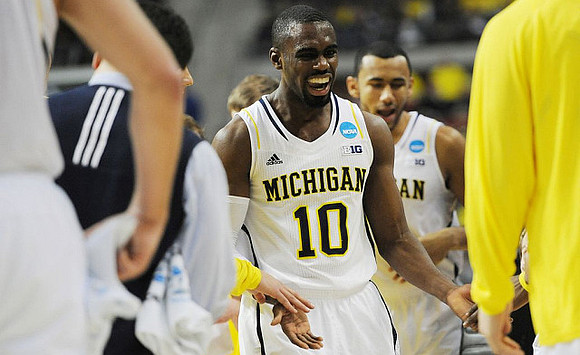 Tim Hardaway Jr. (10) and Jon Horford (15)