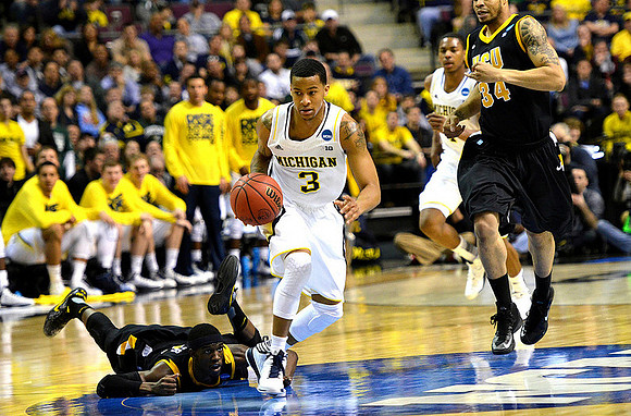 Trey Burke (3) and Glenn Robinson III (1)
