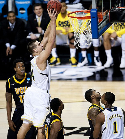 Mitch McGary (4) and Glenn Robinson III (1)