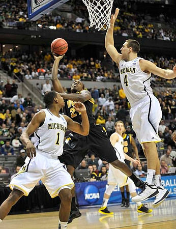 Glenn Robinson III (1), Nik Stauskas (11), and Mitch McGary (4)