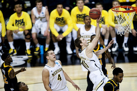 Mitch McGary (4), Nik Stauskas (11), and Glenn Robinson III (12)